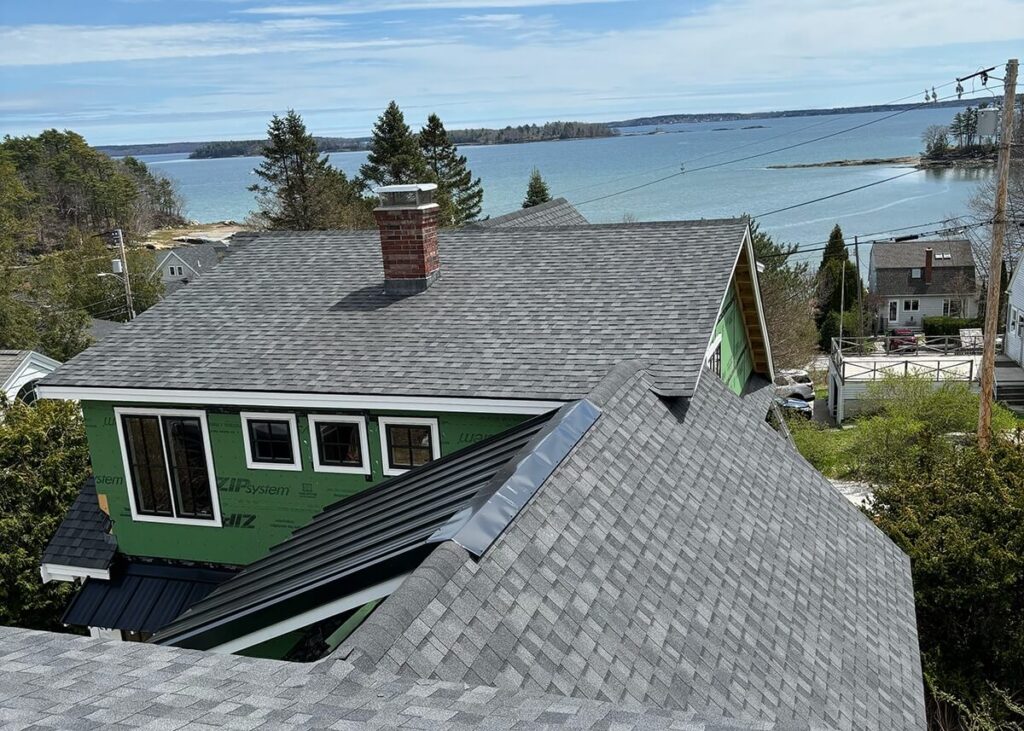 view of a custom roofing job on a coastal maine home